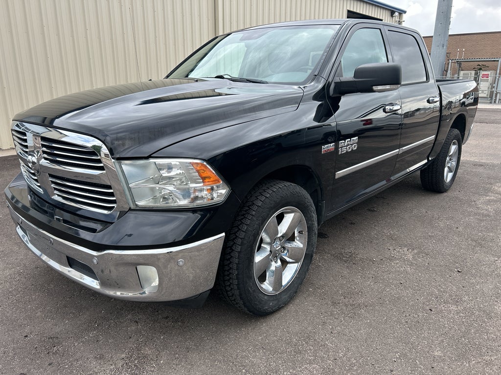 2014 RAM 1500 Big Horn in Black — front three-quarter view