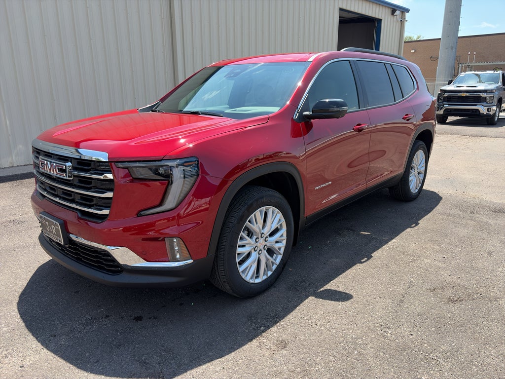 2026 GMC Acadia Elevation in Volcanic Red Tintcoat — front three-quarter view