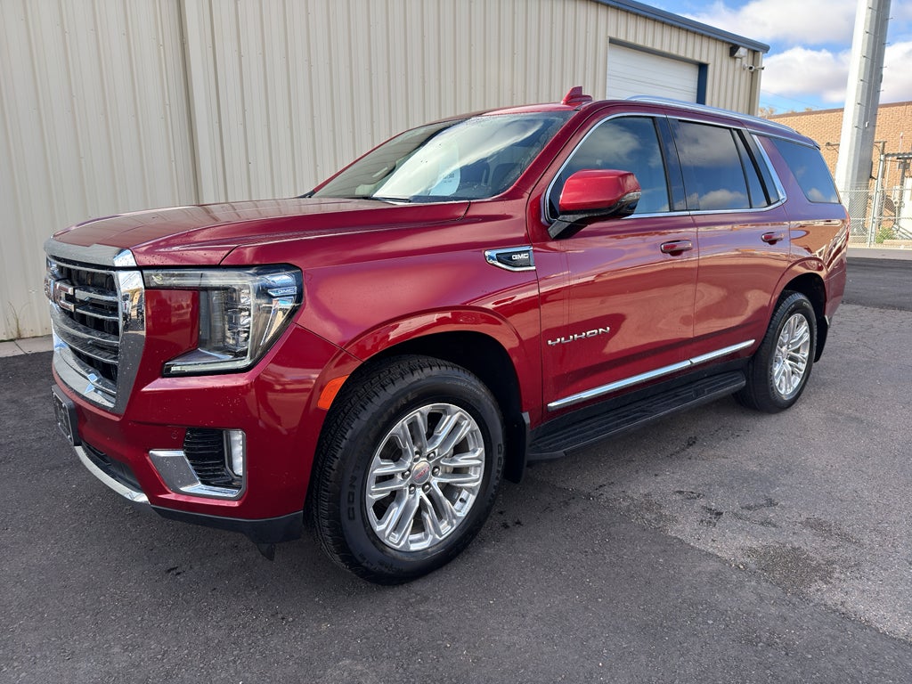 2021 GMC Yukon SLT in Cayenne Red Tintcoat — front three-quarter view