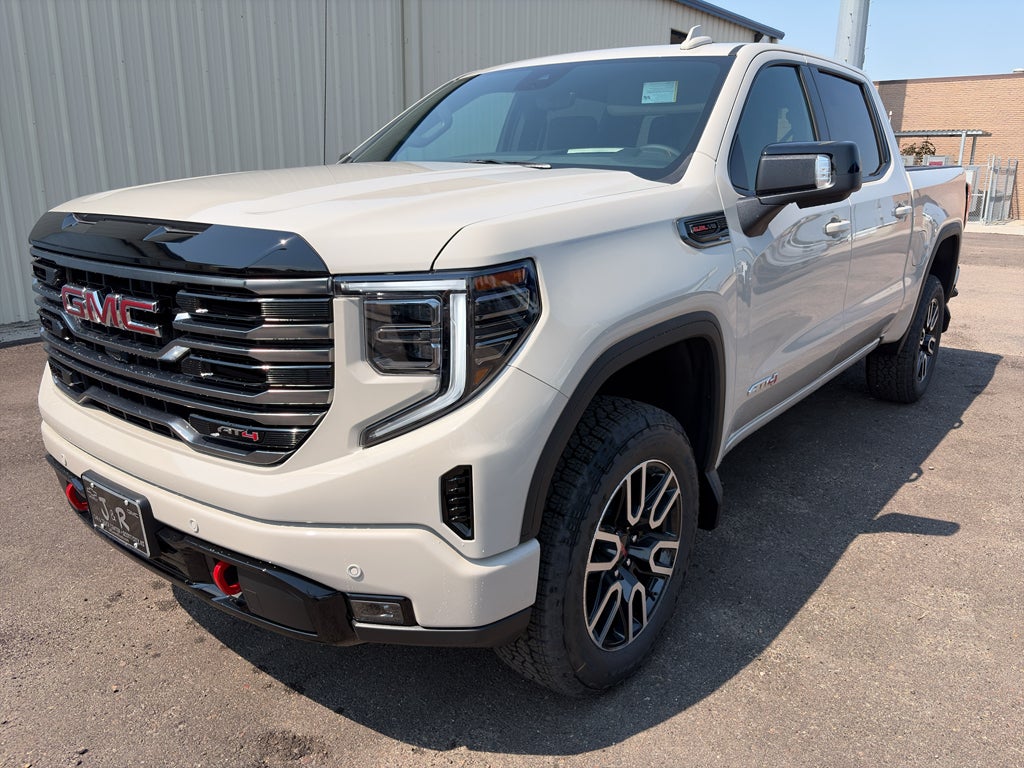 2026 GMC Sierra 1500 AT4 in Coastal Dune — front three-quarter view